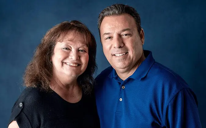 A man and woman posing for a picture.