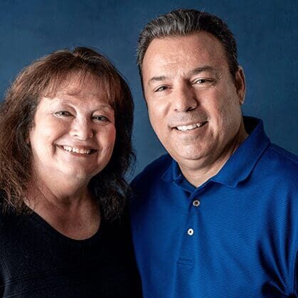 A man and woman posing for a picture.